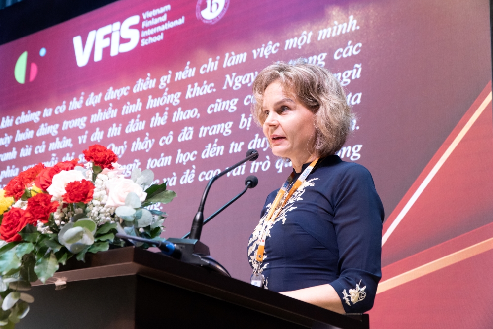 Ms. Miekk-Oja Suvi Kristiina, Head of VFIS, delivering a speech and beating the drum to start the new School Year